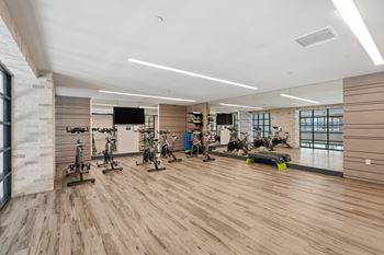 24-Hour fitness club with state-of-the-art fitness equipment including free weights
